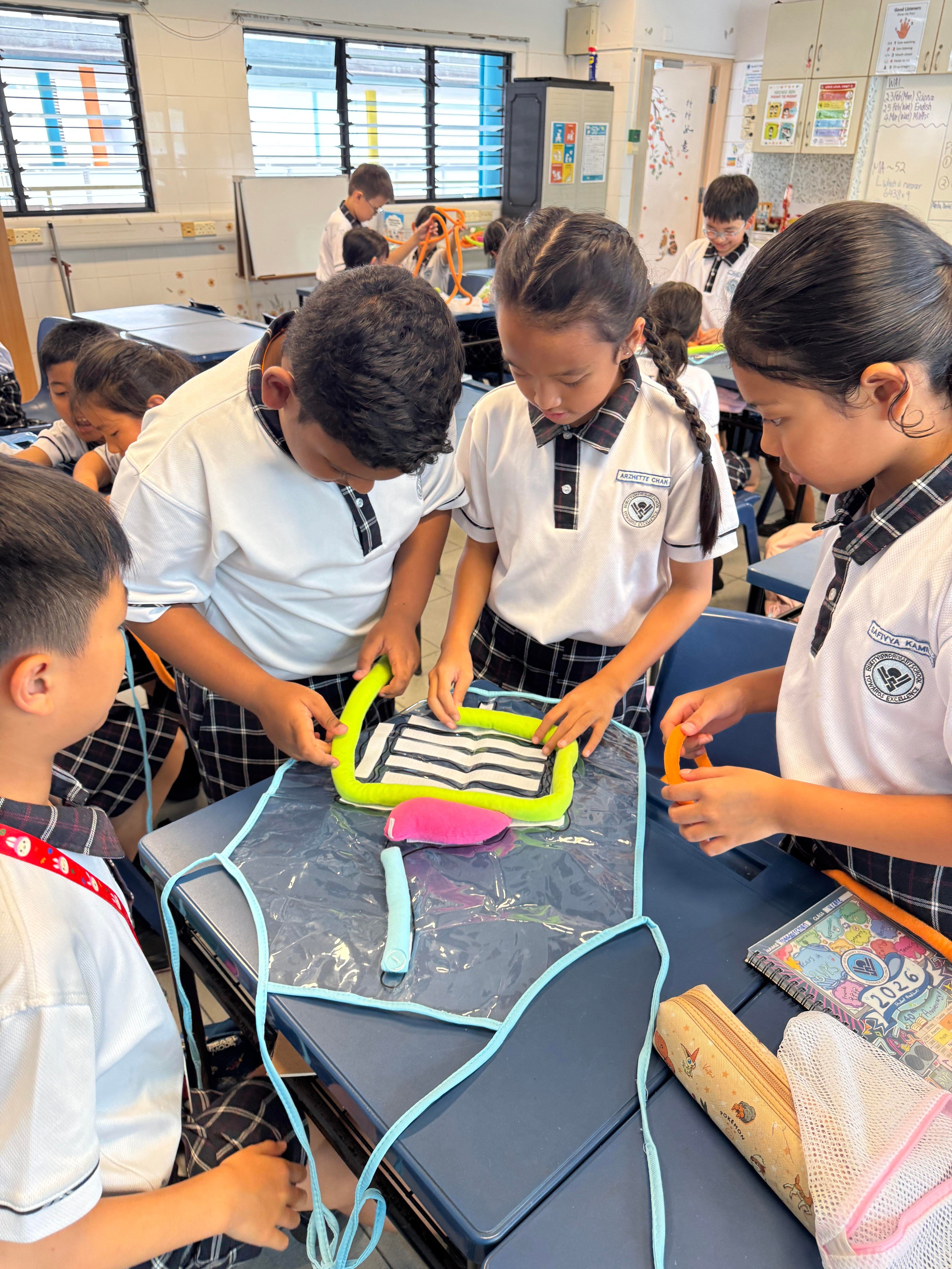 Students engaged in hands-on science activity in the classroom